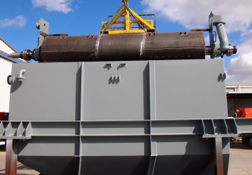 Drive shaft and cage being lowered into the Trommel tank.